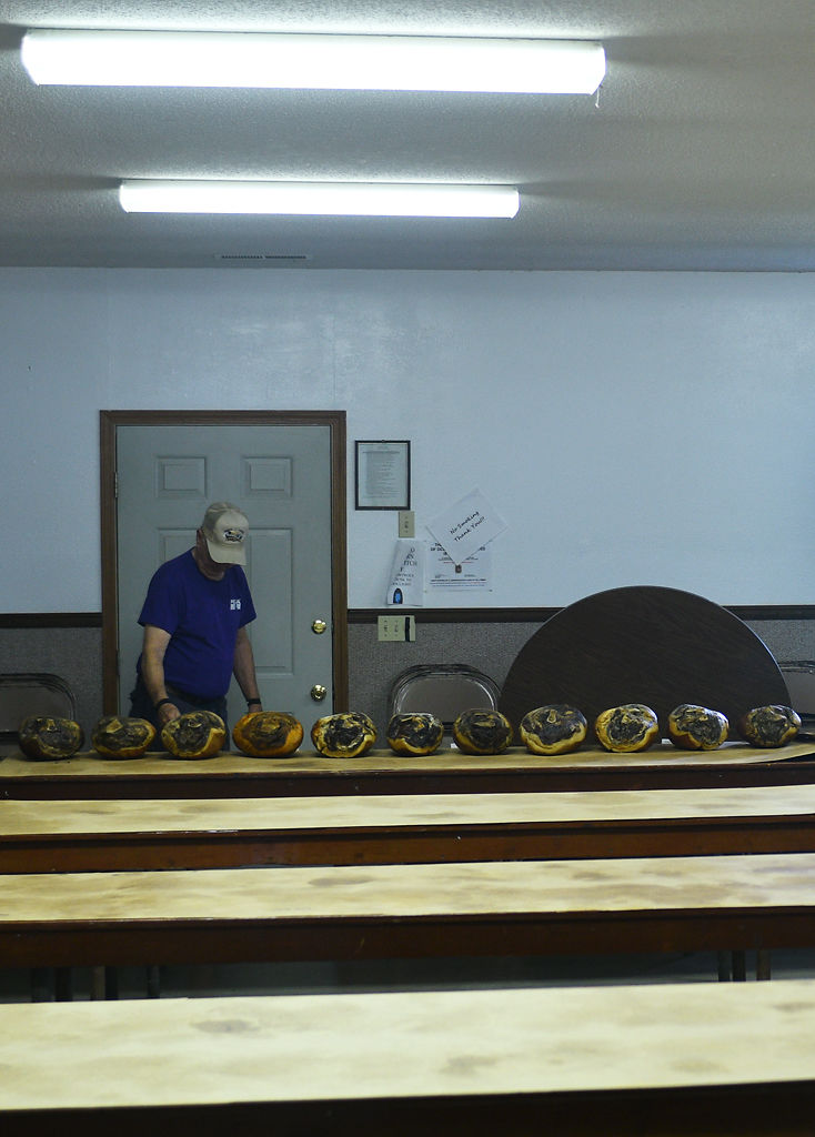 Ray George makes sure the hams are ordered correctly on the tables